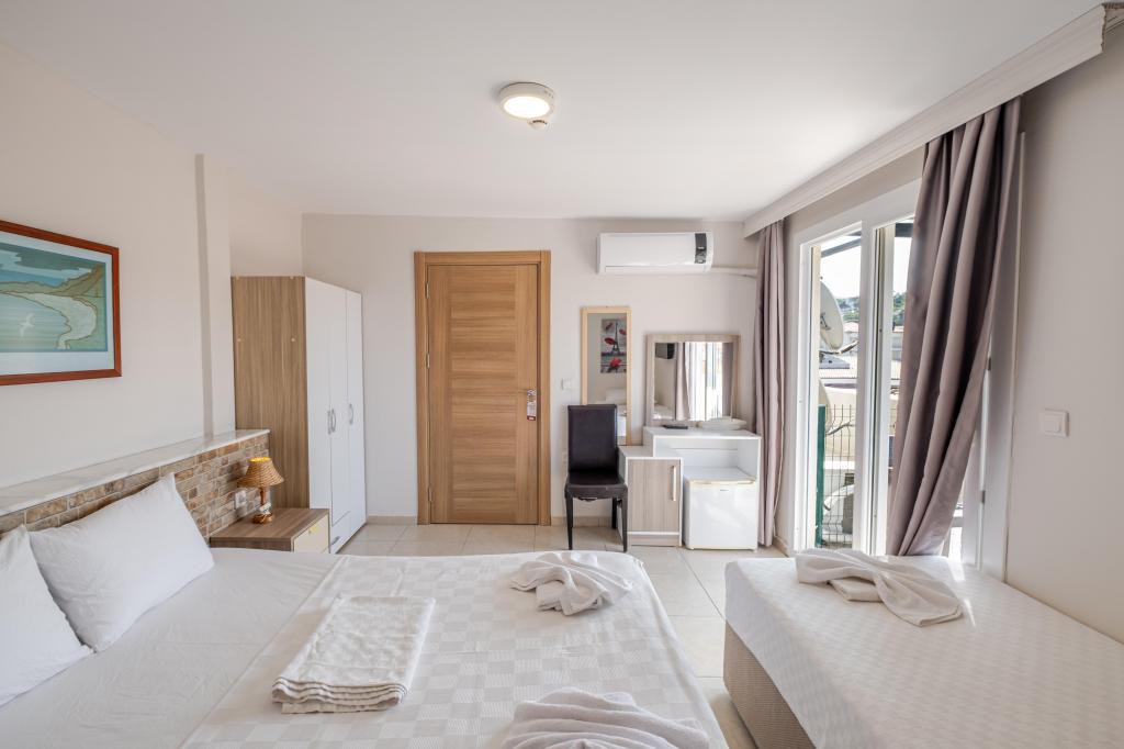Standart Üç Kişilik Oda,Bahçe Manzaralı