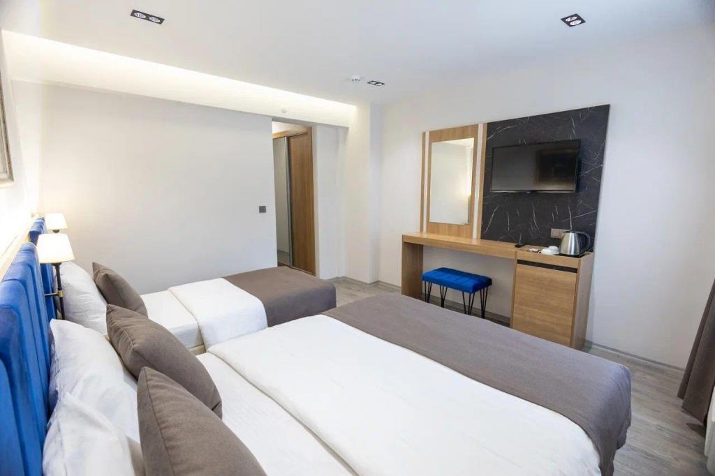 Deluxe Oda Üç Kişilik,Bahçe Manzaralı