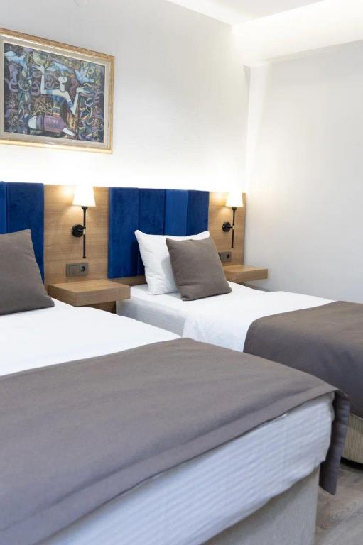 Deluxe Oda Üç Kişilik,Bahçe Manzaralı