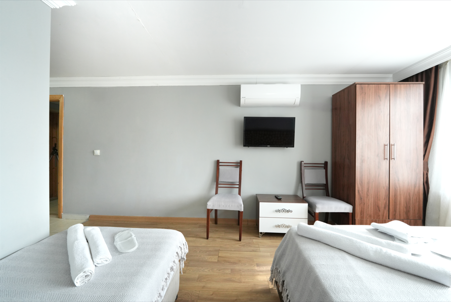 Deluxe Üç Kişilik Oda ,Deniz ve Dağ Manzaralı