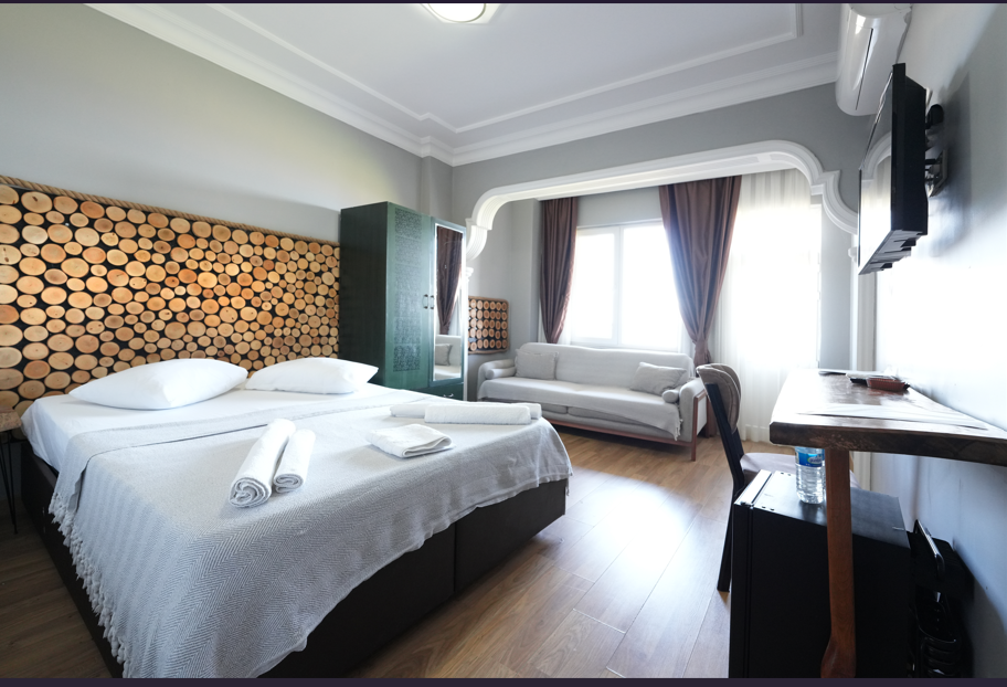 Deluxe Üç Kişilik Oda ,Deniz ve Dağ Manzaralı