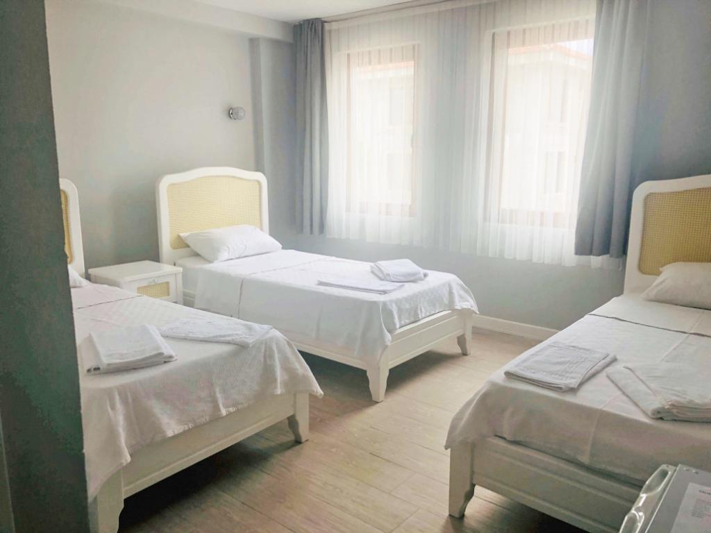 Comfort Üç Kişilik Oda, Bahçe Manzaralı